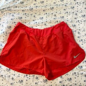 Red Nike shorts